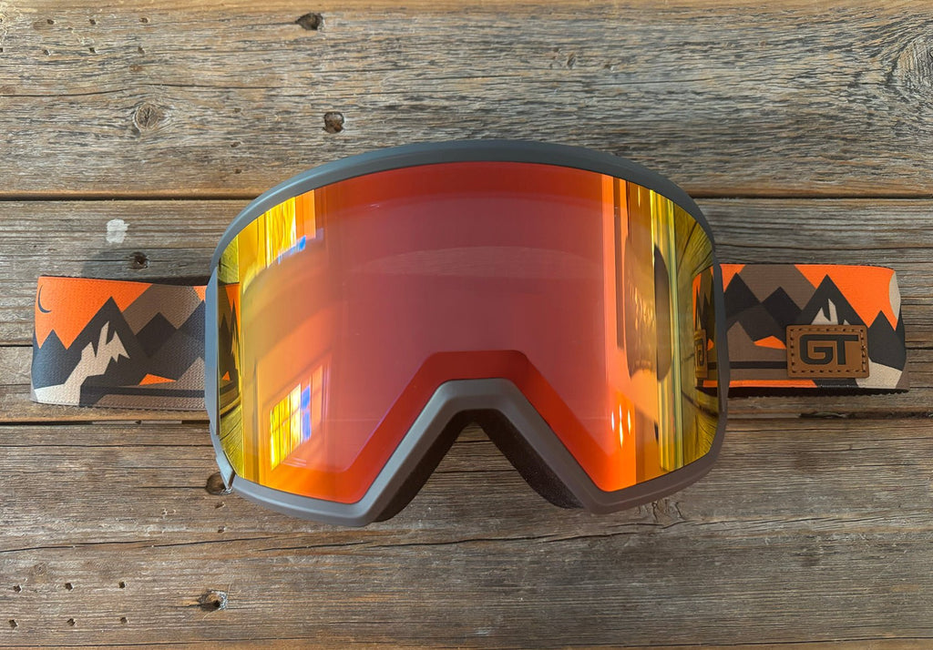 MHDUB Backcountry Pro Gabe Taylor goggle, red mirror lens, orange mountain print strap with GT patch