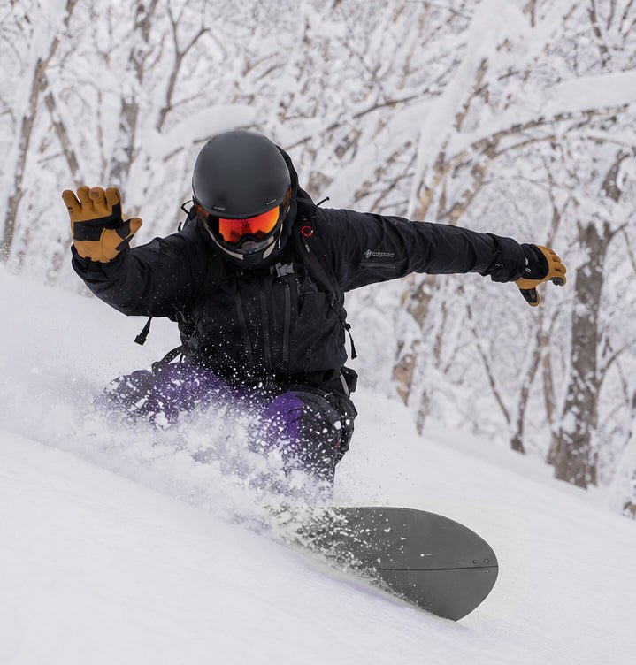 Snowboarder wearing Backcountry Pro snow goggles by MHDUB on snow