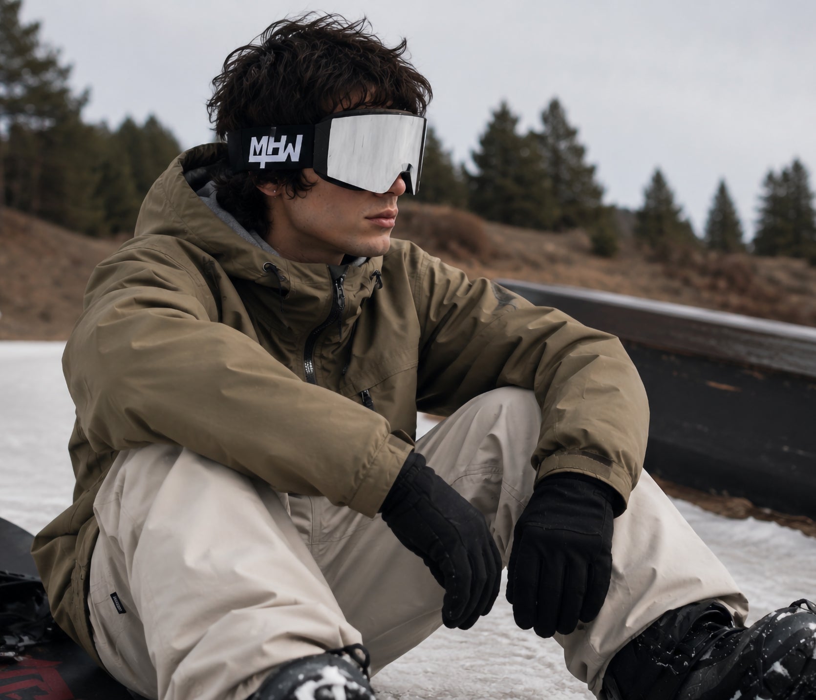 Snowboarder wearing Blacked Out snow goggles by MHDUB on snow