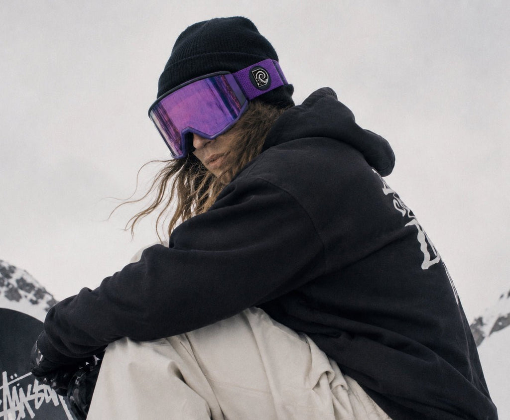 Snowboarder wearing Purple Haze snow goggles by MHDUB on snow